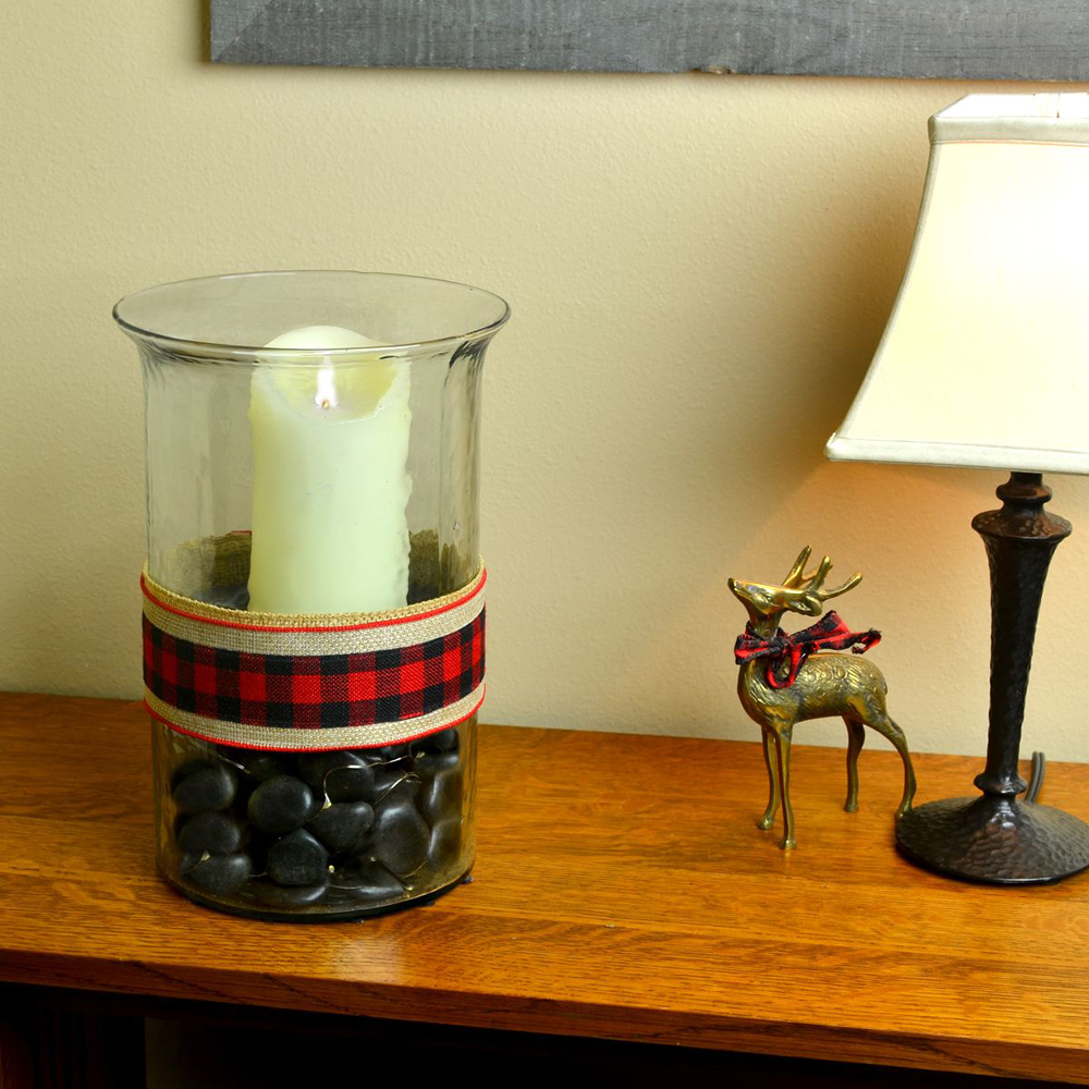 Black Polished Stone in a vase with a candle
