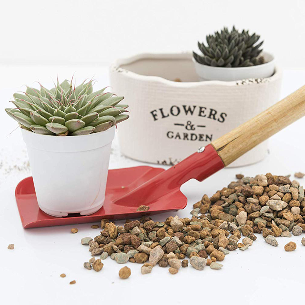 River Gravel shown with shovel and potted succulents